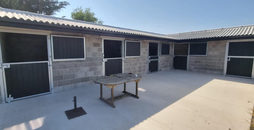 Chosen by the owner, this dark grey on grey looks fantastic! Stable Block installed with Dark Grey finish, split pony door, matching clad windows and tack room