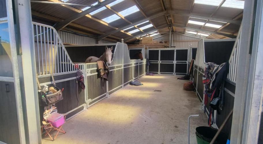 Prestige range internal stables with tack room Prestige range internal stables with tack room, glazed barn doors, glazed windows and very happy horses.s